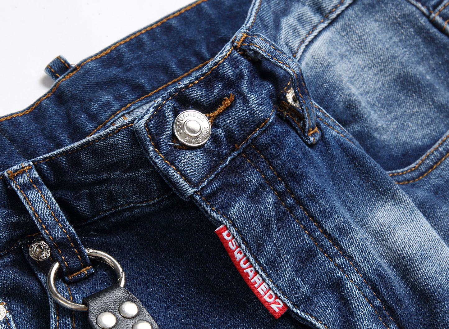 Men’s ripped fashion jeans with ornamental details, slim fit, and distressed design for a trendy streetwear look.