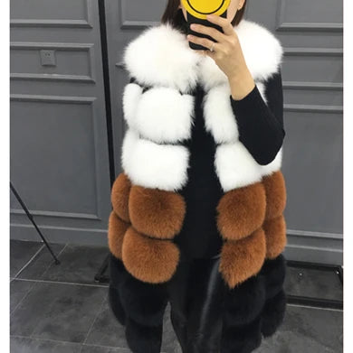 Woman wearing a colorful patchwork faux fur vest in winter setting