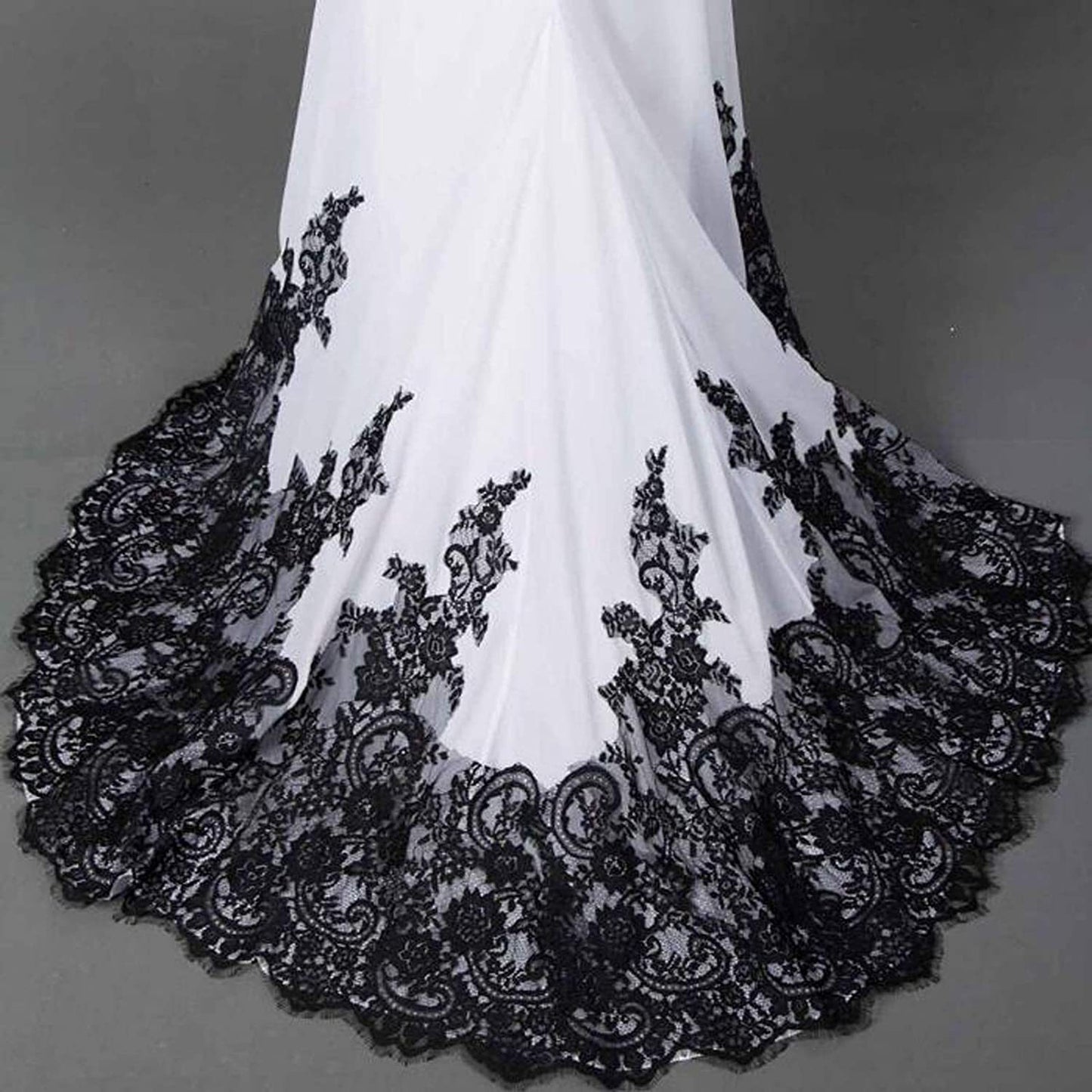 A slim mermaid wedding dress with a figure-flattering silhouette and flowing tail, designed for an elegant and timeless bridal style.