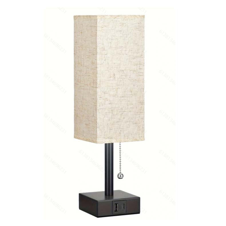Modern square linen desk lamp with USB charging ports and 3-color dimmable lighting on a minimalist nightstand

