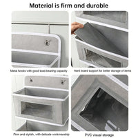 5-pocket hanging organizer on the back of a white bedroom door


