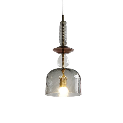 Colorful macaron-style glass chandeliers hanging over a modern bar counter

