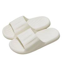 Unisex striped home slippers with thick soles and non-slip bottoms in solid colors.

