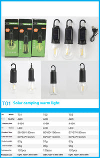 Solar-powered camping lantern with tungsten bulb hanging in a tent outdoors

