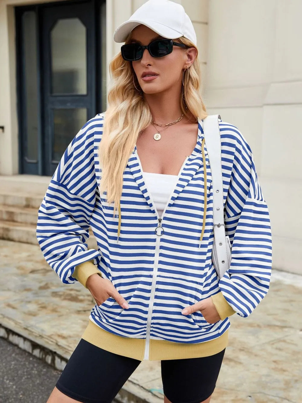 Women’s drawstring hoodie with stripe sleeve design – zip-up long sleeve sweatshirt.

