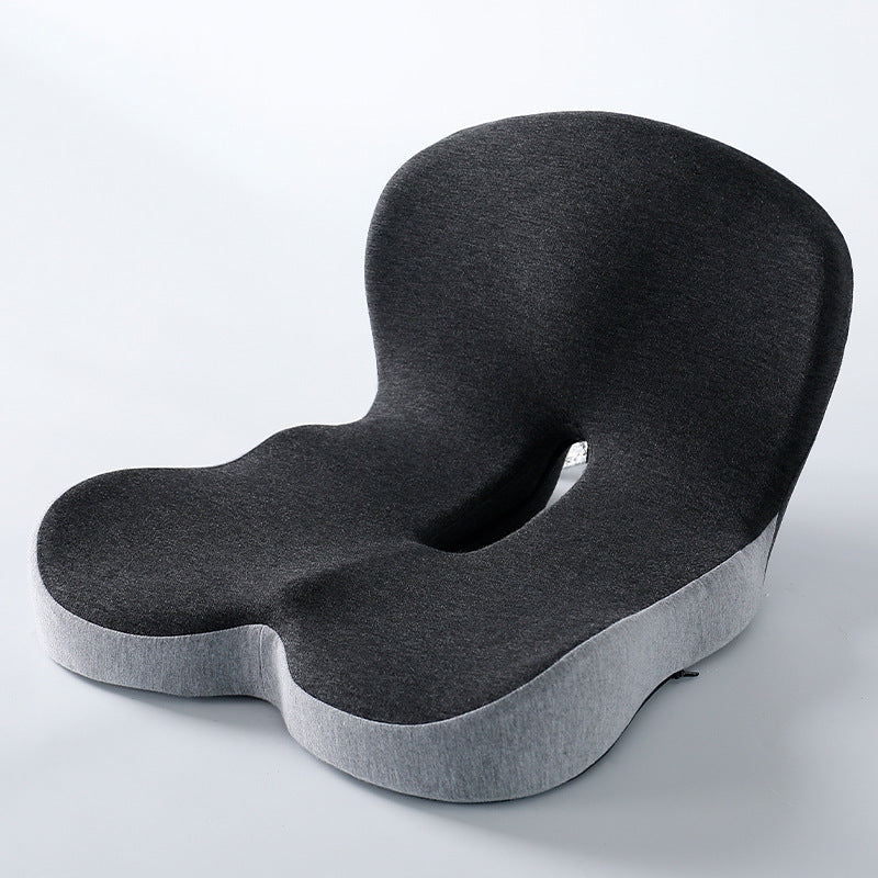 Memory foam ergonomic cushion with integrated back and seat support on an office chair

