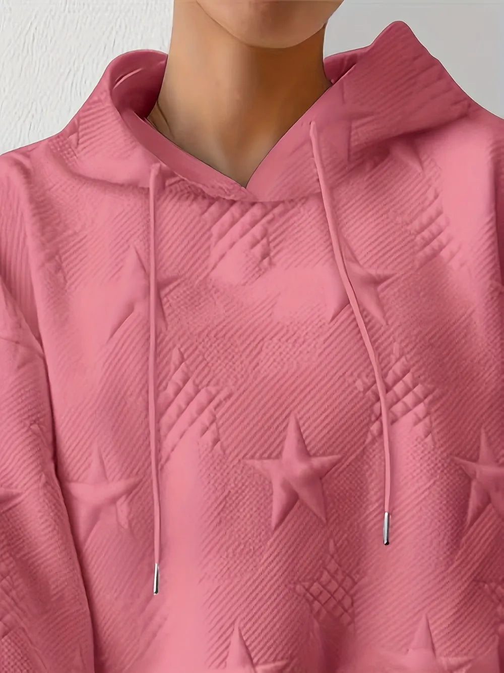 White women’s casual pullover hoodie with star texture and drawstring hood.








