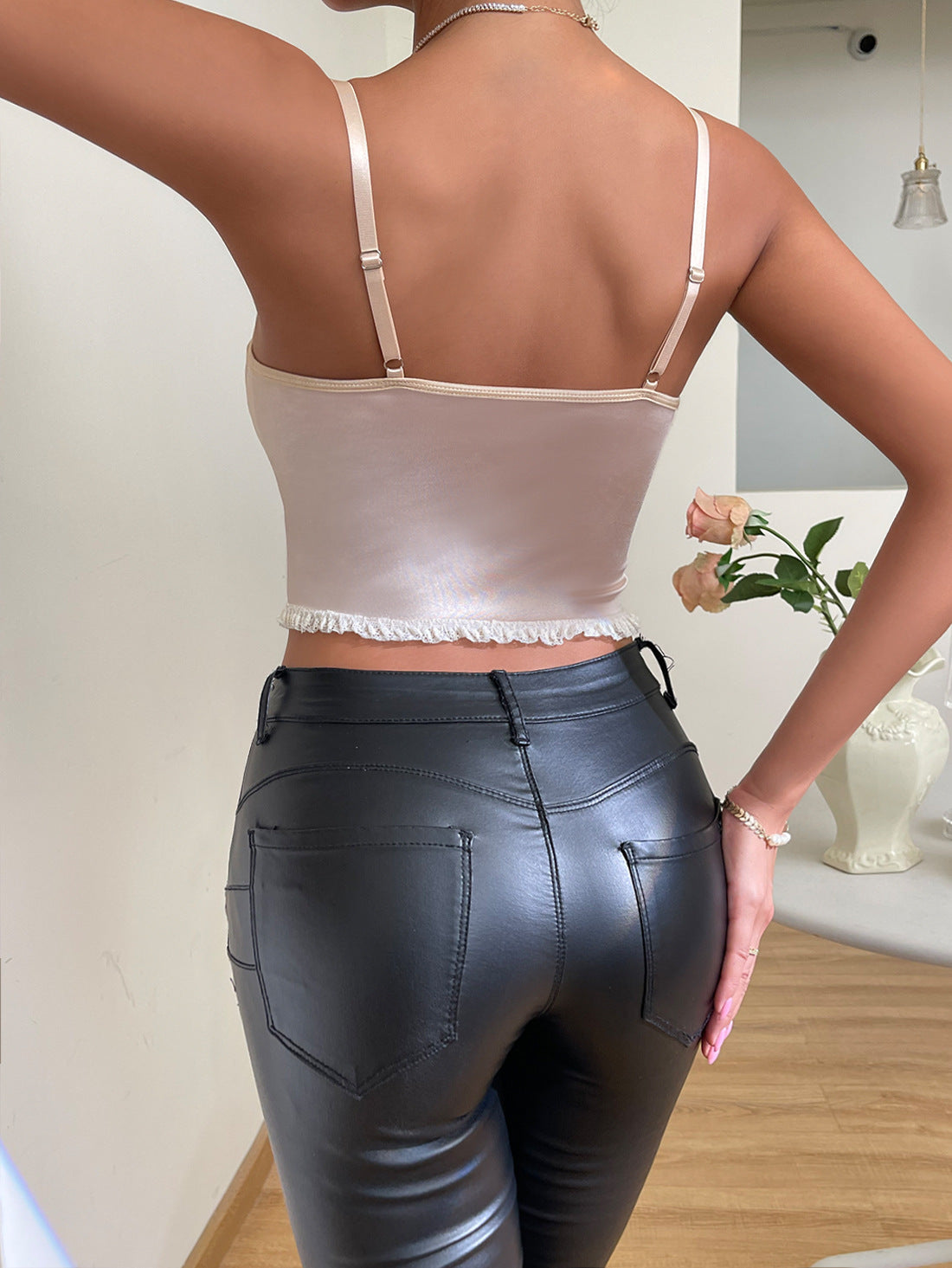 Lace Printed Satin Shaped Cross-rope Small Lace Fishbone Camisole – Elegant satin camisole with lace print, cross-rope design, and fishbone structure.








