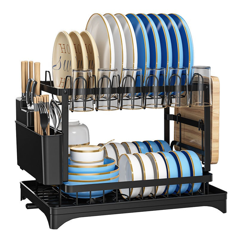 Kitchen drainage rack with bowls, plates, and utensils drying on a countertop

