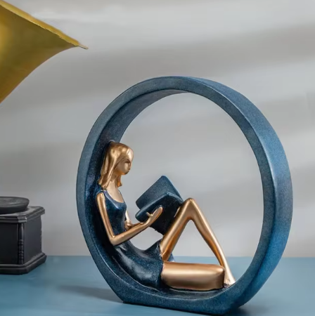 OK Reading Girl resin desktop decoration, depicting a girl engrossed in a book, crafted with fine details to add a whimsical and artistic touch to any workspace or home decor.
