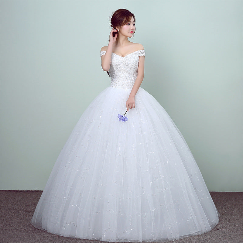 Simple and slim white wedding dress with a sleek design, perfect for brides who prefer minimalist elegance.

