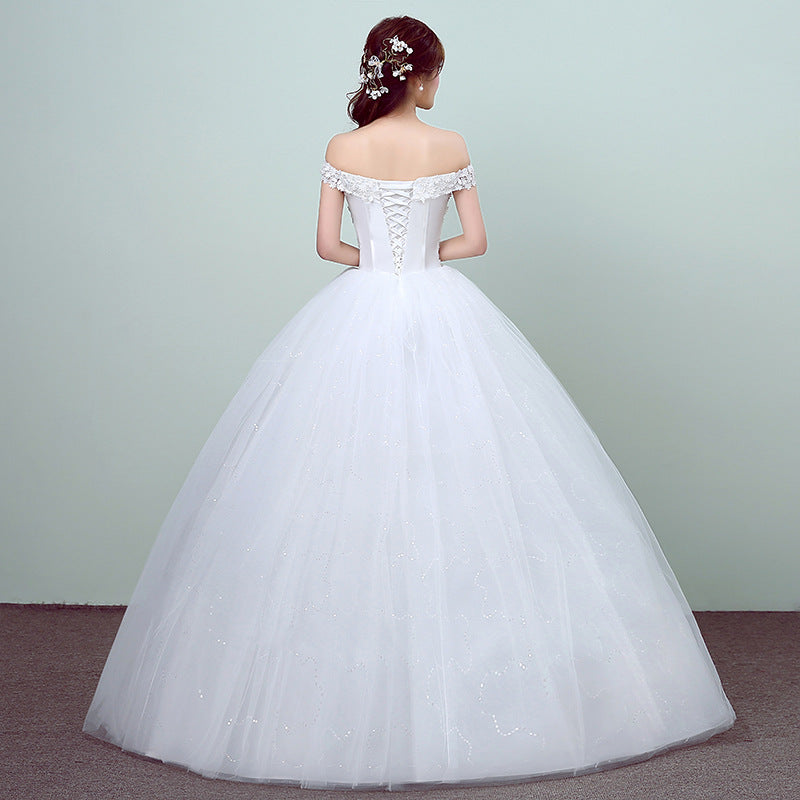 Simple and slim white wedding dress with a sleek design, perfect for brides who prefer minimalist elegance.

