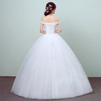 Simple and slim white wedding dress with a sleek design, perfect for brides who prefer minimalist elegance.


