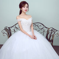 Simple and slim white wedding dress with a sleek design, perfect for brides who prefer minimalist elegance.


