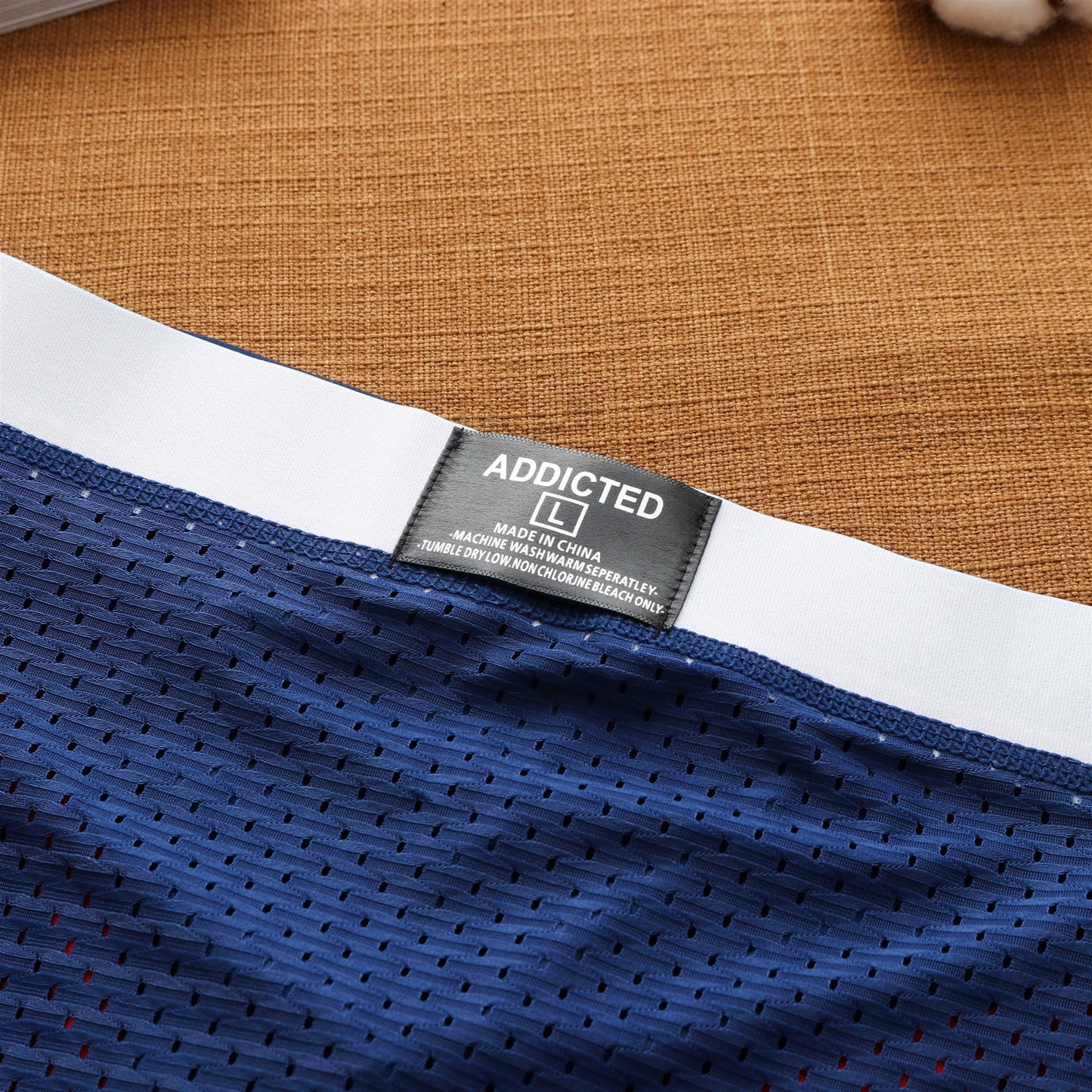 Men’s breathable ice silk mesh low waist sexy briefs in a trendy design


