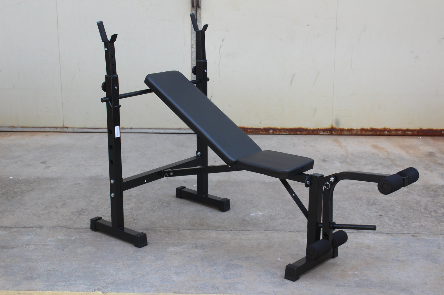 Olympic weight bench with adjustable squat rack, designed for strength training, featuring sturdy construction and multiple settings for bench press, squats, and other weightlifting exercises.