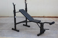 Olympic weight bench with adjustable squat rack, designed for strength training, featuring sturdy construction and multiple settings for bench press, squats, and other weightlifting exercises.