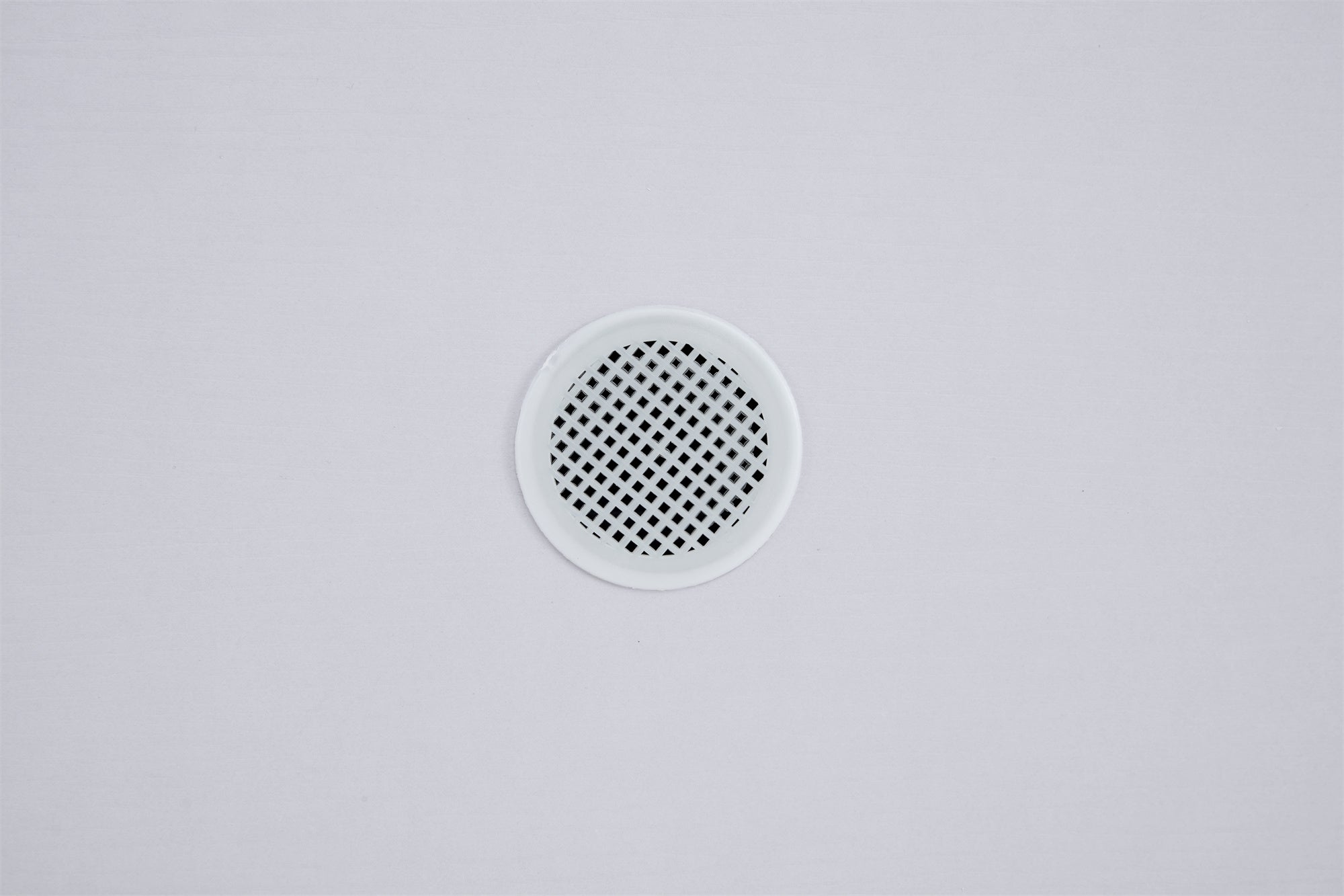 White shoe cabinet with open shelves and metal legs