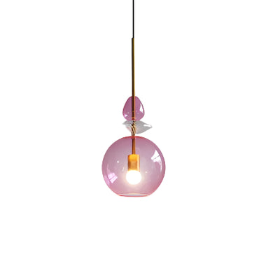 Colorful macaron-style glass chandeliers hanging over a modern bar counter

