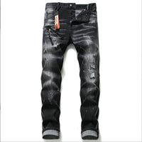 Men’s black and gray distressed jeans with torn holes and zipper decoration.

