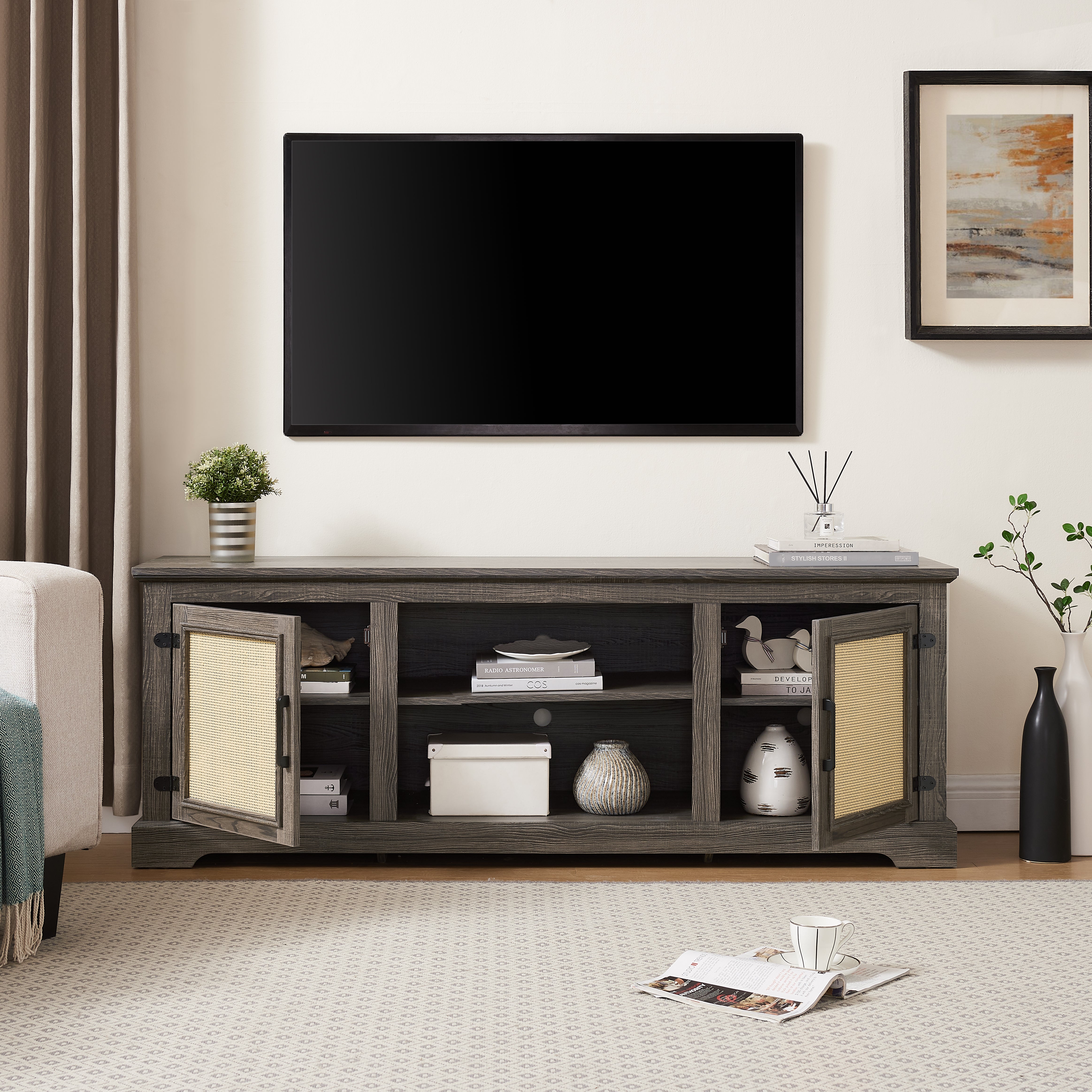 Gray TV stand with rattan doors and shelves for storage