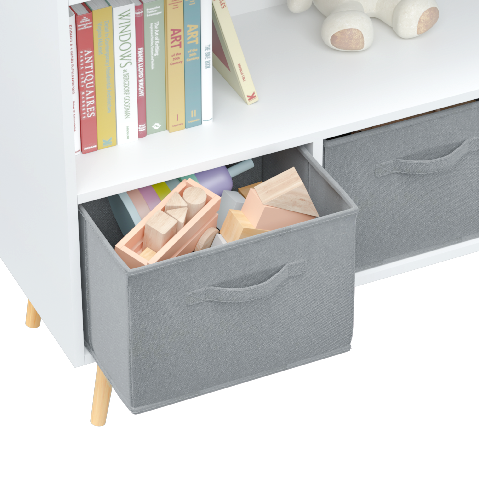 White kids bookcase with gray fabric drawers and books displayed