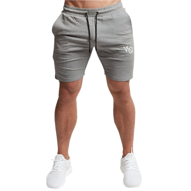 "Men's workout running shorts made from lightweight, moisture-wicking fabric for comfort and breath ability. The shorts feature an elastic waistband with an adjustable drawstring, side pockets, and a relaxed fit, perfect for running or intense workout sessions."