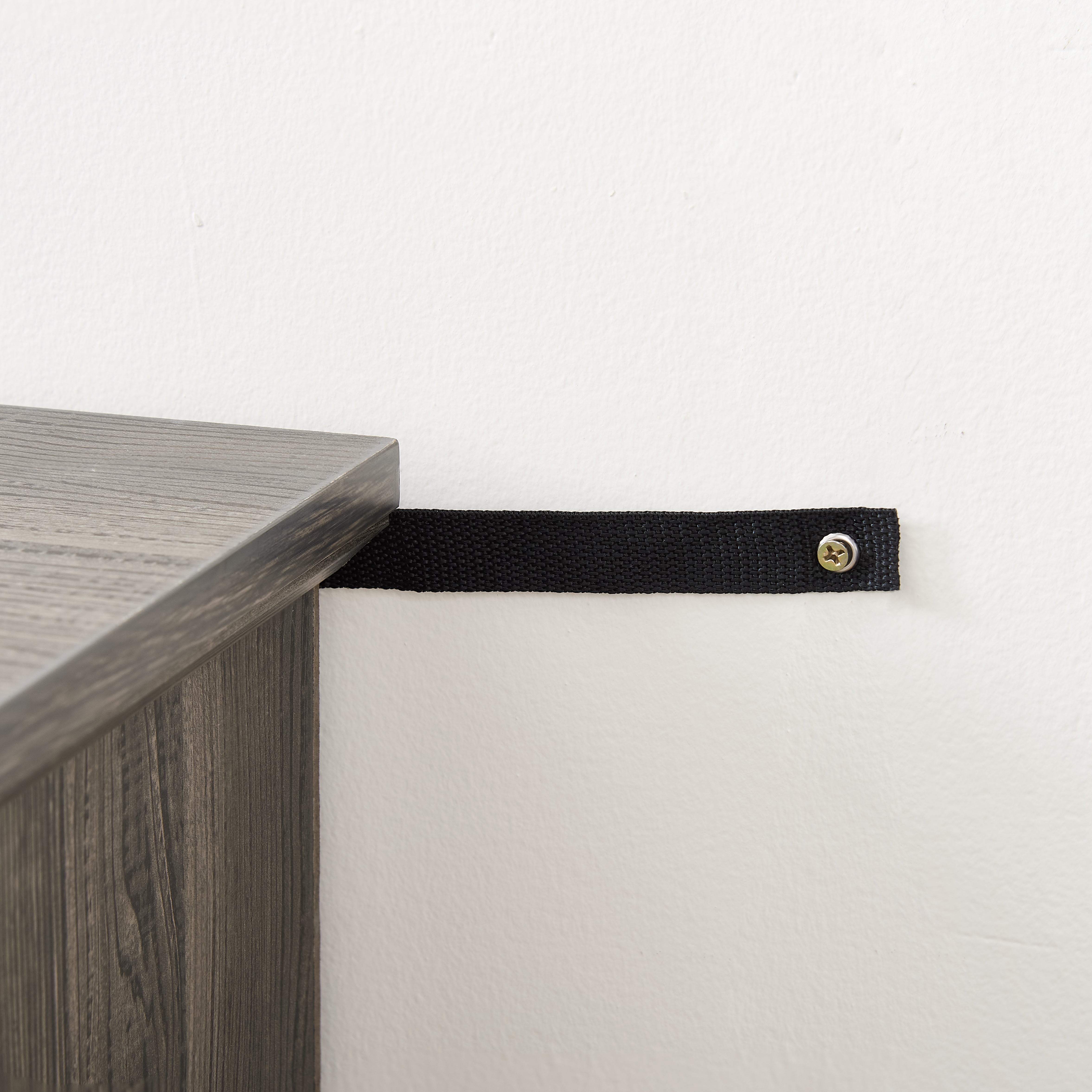 Gray TV stand with rattan doors and shelves for storage