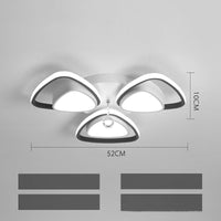 High-end modern ceiling light illuminating a cozy bedroom with elegant decor

