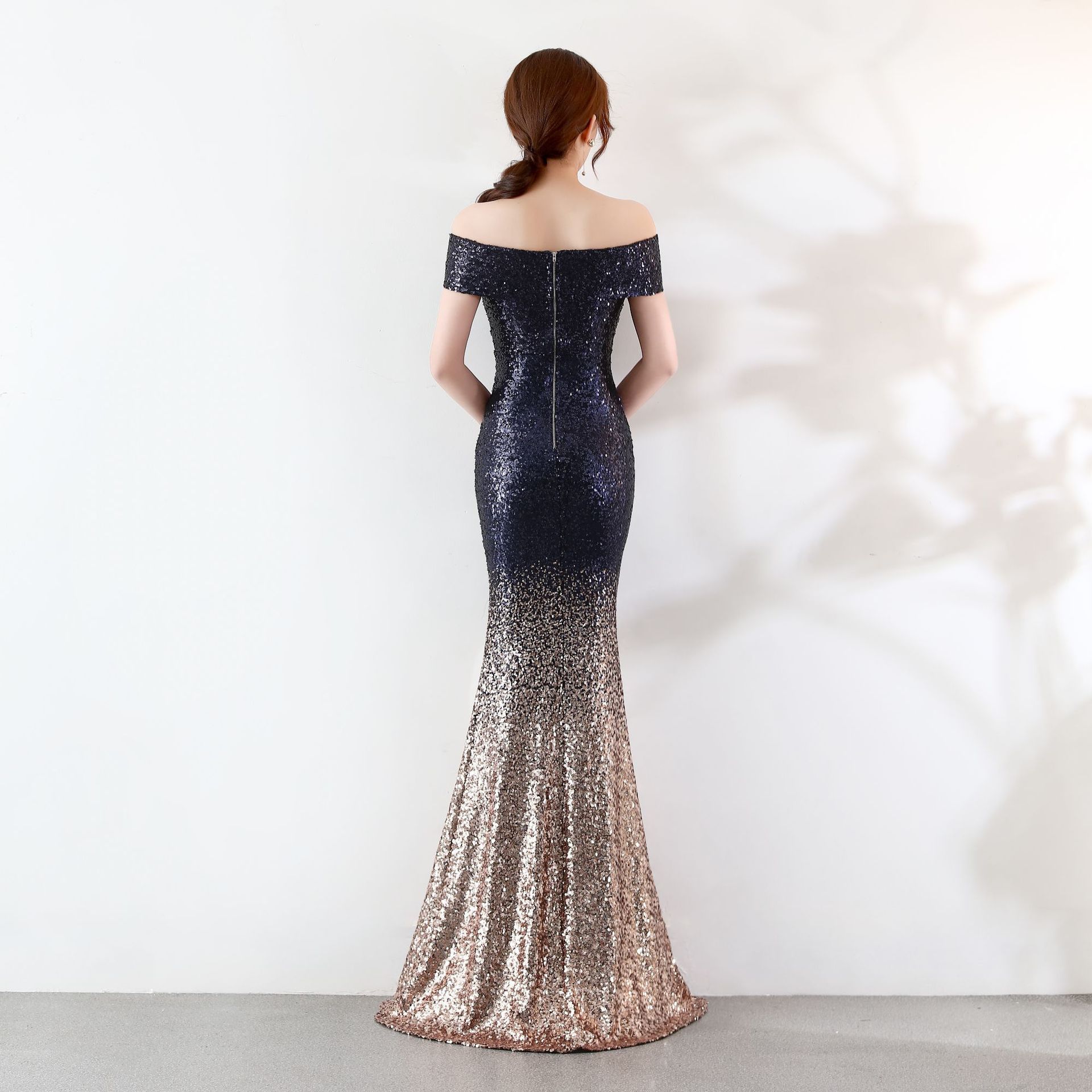 Elegant slimming long dress for birthday parties and event hosting, featuring a figure-hugging design and a graceful silhouette.

