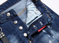 Men’s ripped fashion jeans with ornamental details, slim fit, and distressed design for a trendy streetwear look.