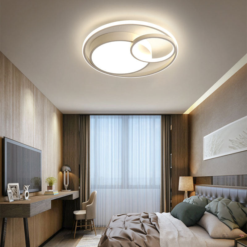 Modern Nordic-style nested round chandelier hanging in a minimalist living room

