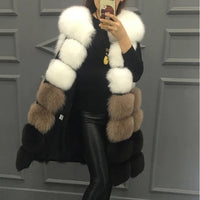 Woman wearing a colorful patchwork faux fur vest in winter setting
