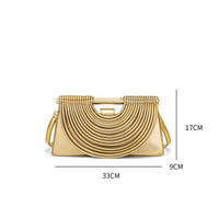A gold metallic clutch handbag with a pleated semi-circular design, shown with dimension lines indicating measurements of 33cm width, 17cm height, and 9cm depth on a white background.