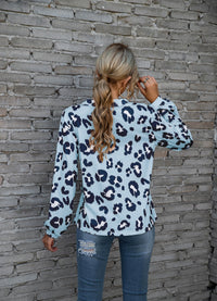 Women's long-sleeve V-neck top with a bold leopard print pattern, perfect for adding a touch of fierce fashion to your wardrobe.









