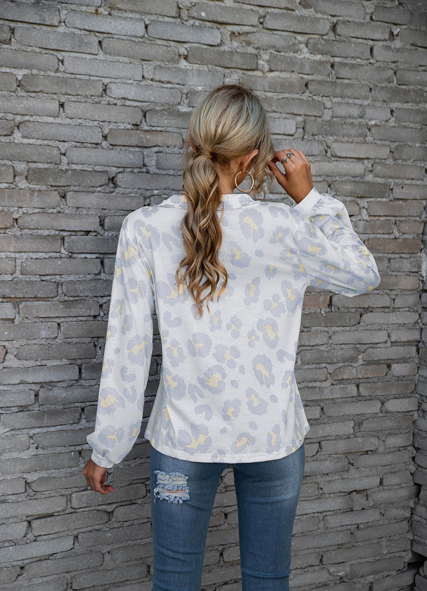 Women's long-sleeve V-neck top with a bold leopard print pattern, perfect for adding a touch of fierce fashion to your wardrobe.








