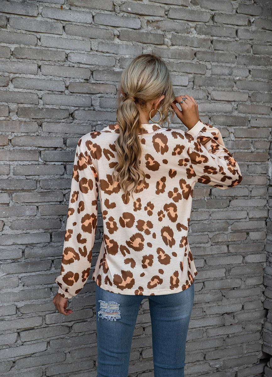 Women's long-sleeve V-neck top with a bold leopard print pattern, perfect for adding a touch of fierce fashion to your wardrobe.








