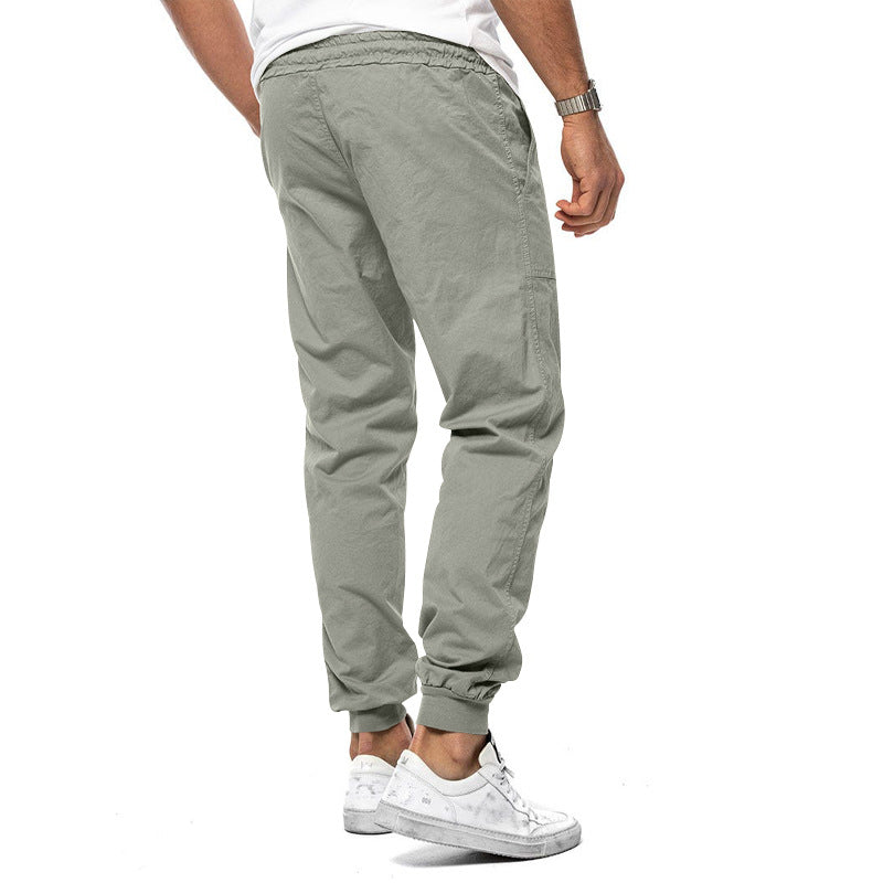 Loose tapered fit casual pants for men, perfect for spring and autumn, with multiple pockets and a stylish, comfortable design for outdoor or leisure wear.
