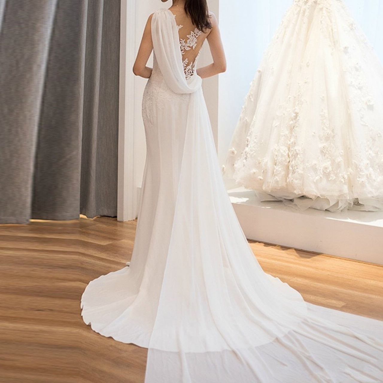 Elegant mid-waist see-through light wedding dress with a dreamy, fairy-like design, featuring delicate lace and a soft flowing silhouette.

