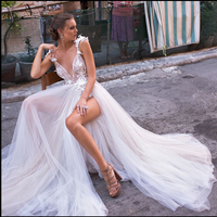 Elegant angel-style wedding dress with diamond lace collar, high slit, open back, and flowing bridal tail, perfect for a modern and romantic bride.

