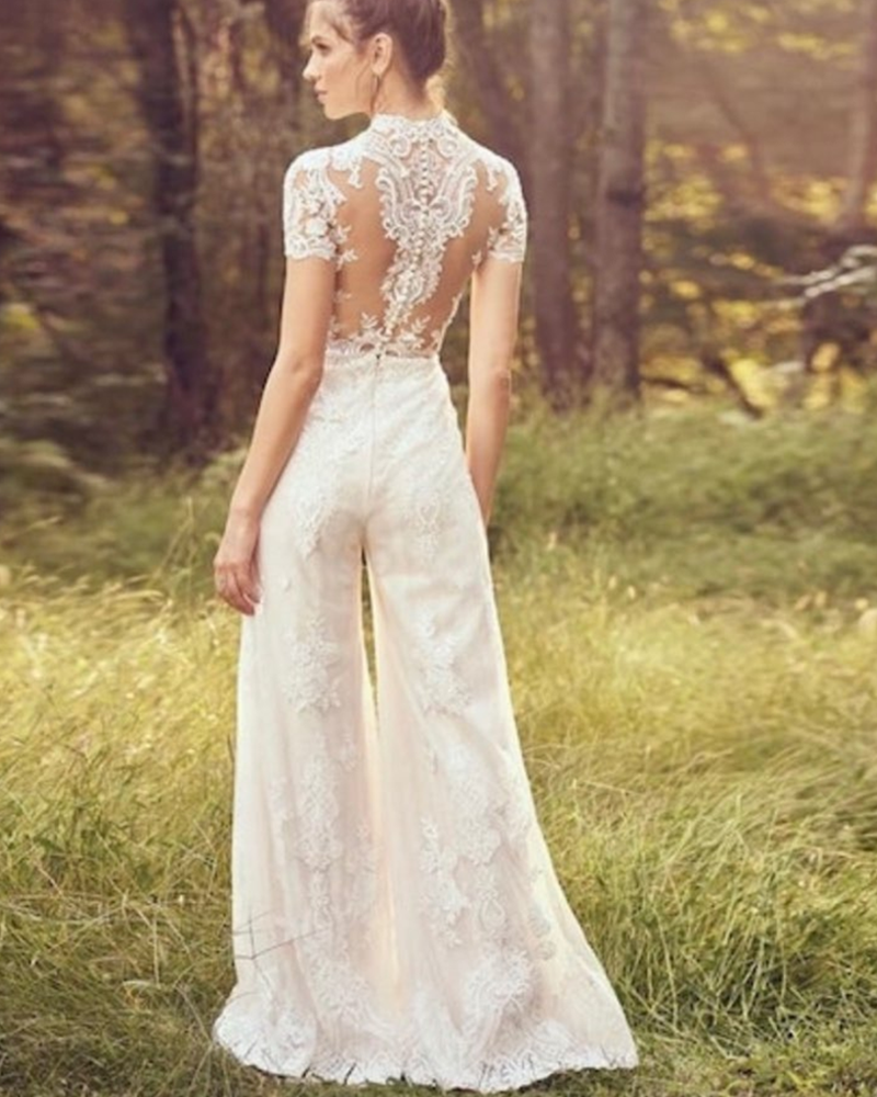 Modern bride pants suit featuring a short sleeve wedding jumpsuit, tailored for elegance and a sophisticated bridal look.

