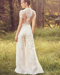 Modern bride pants suit featuring a short sleeve wedding jumpsuit, tailored for elegance and a sophisticated bridal look.

