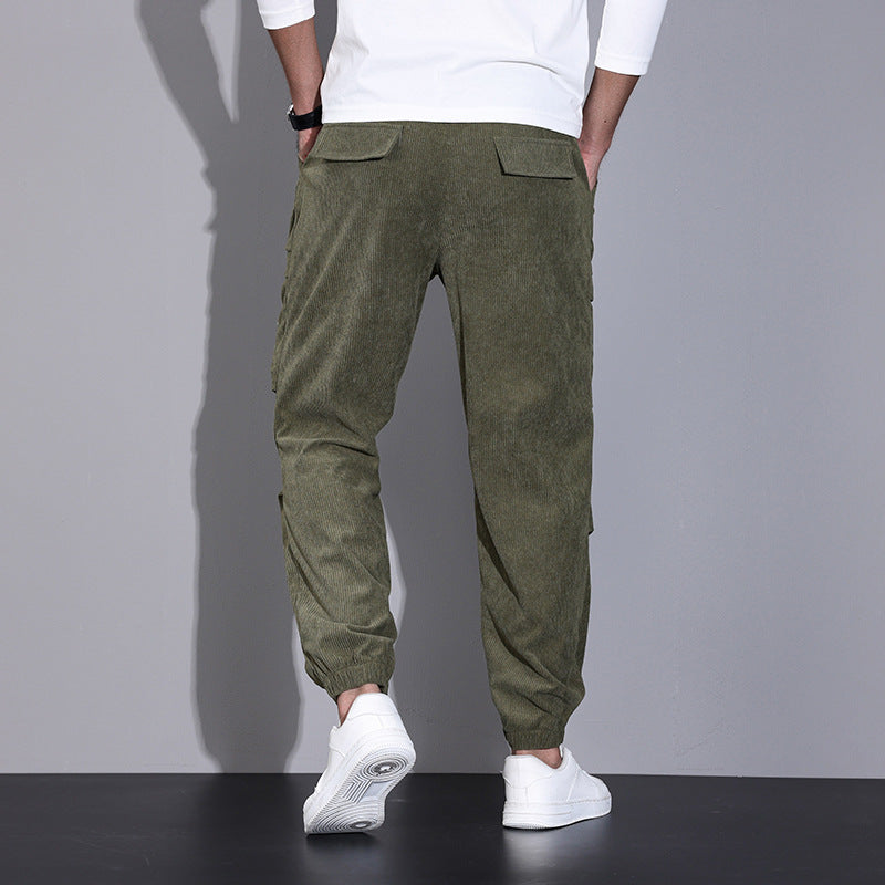 Men's corduroy overalls with ankle-tied loose fit and multi-pocket design for casual wear.