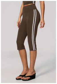 Brown capri leggings with white stripes on a plain background