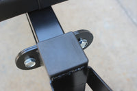 Olympic weight bench with adjustable squat rack, designed for strength training, featuring sturdy construction and multiple settings for bench press, squats, and other weightlifting exercises.