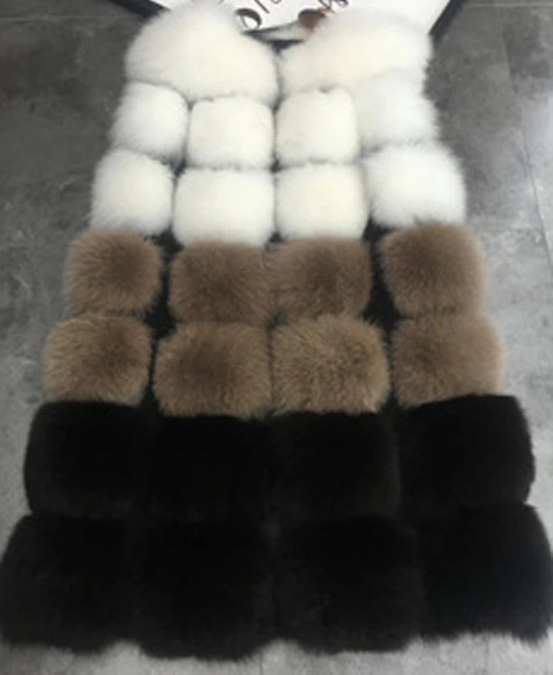 Woman wearing a colorful patchwork faux fur vest in winter setting