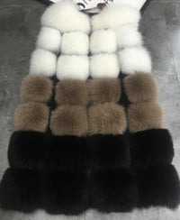 Woman wearing a colorful patchwork faux fur vest in winter setting