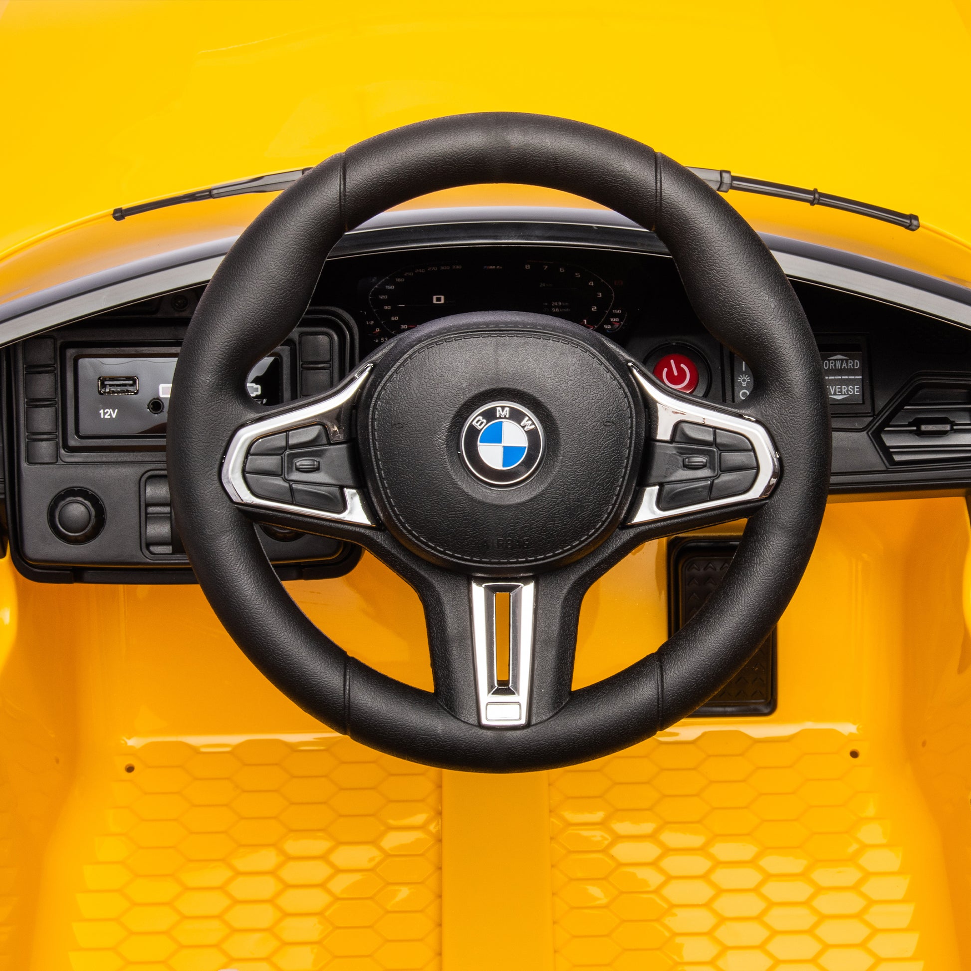 Yellow BMW M4 12V electric ride-on car for kids, featuring authentic design with working headlights, MP3 player, and forward/reverse motion. Comes with adjustable seat and steering wheel, providing a realistic driving experience for children aged 3-6