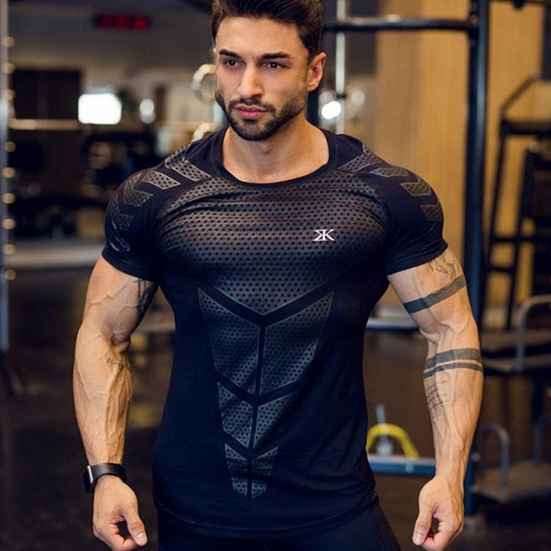 Man wearing a tight-fit short sleeve compression T-shirt in quick-dry fabric for running and sports training.

