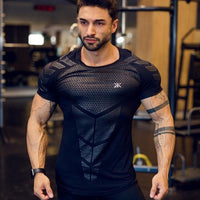 Man wearing a tight-fit short sleeve compression T-shirt in quick-dry fabric for running and sports training.

